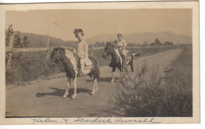 Pictured are Sanders and Helen Russell on the racetrack at 'Russell Stables'